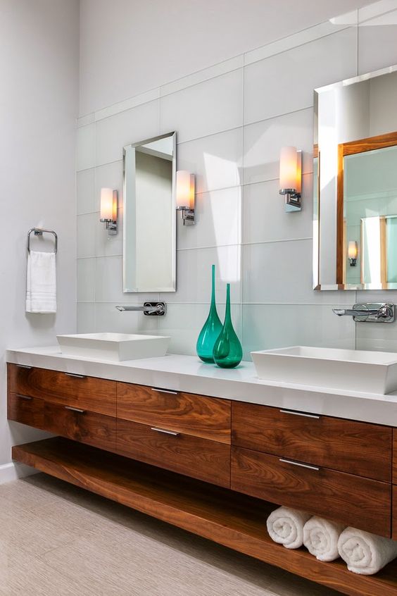 white bathroom with natural wood bathroom vanity with two vessel sinks