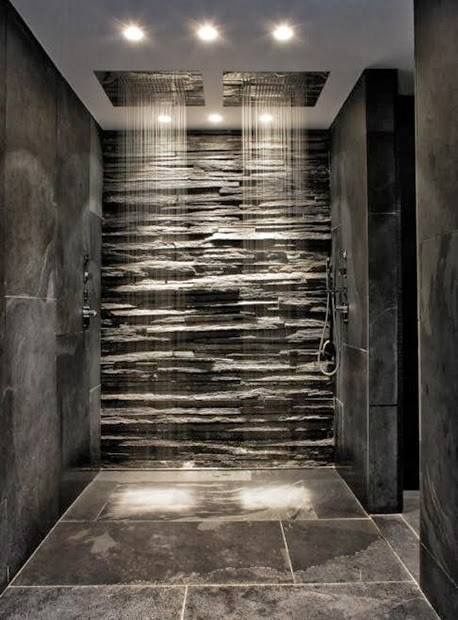 walk in shower stone wall dual rain shower heads gray tile
