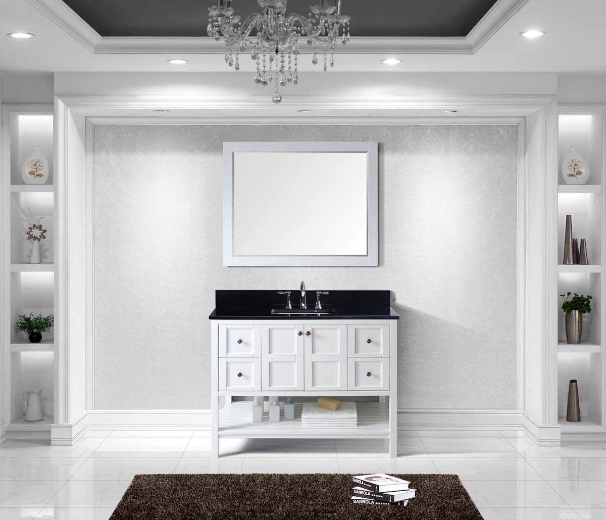 A beautiful transitional white vanity with a striking black top