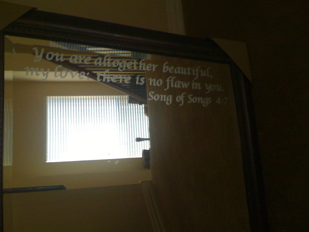 The finished product - a bathroom mirror with an inspirational quote etched into it