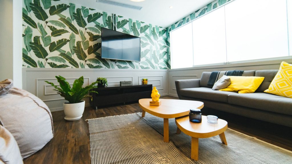 fun trendy plant wallpaper in living room